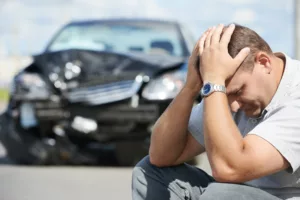 Guy with hands in face after an accident with Auto Insurance in Wylie, McKinney, Allen, Frisco, Plano, Dallas & Surrounding Areas 